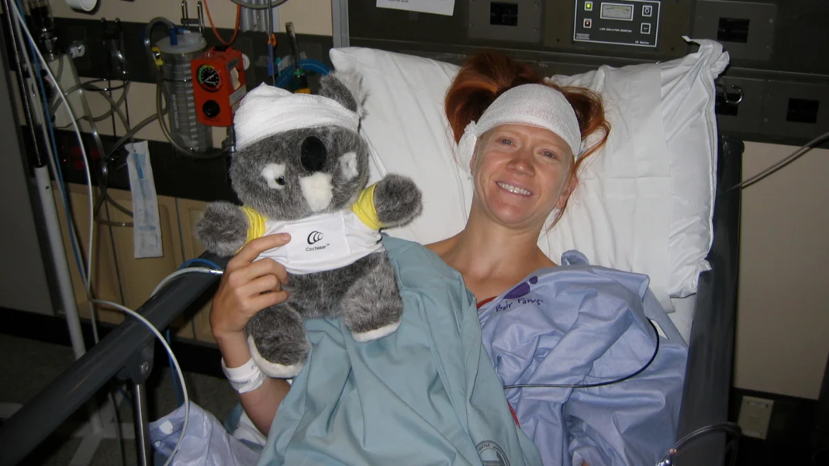Kelly with stuffed animal after surgery